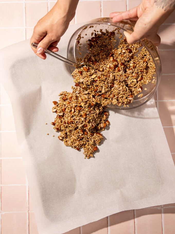 scraping buckwheat onto baking sheet